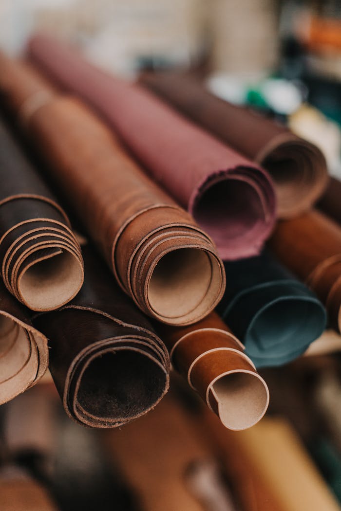 Mastering the First Impression: Your intriguing post title goes here Close-up of various colored leather rolls in a workshop, featuring texture and vibrant hues.