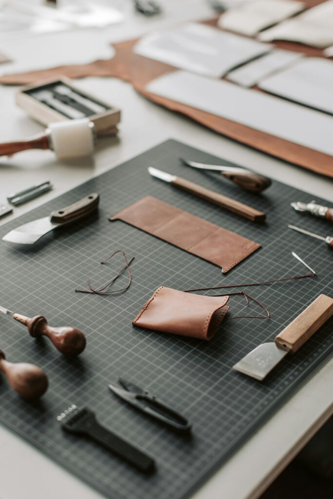 pexels photo 4452603 4452603 Close-up of tools and materials on a leather crafting workspace, showcasing artisanal craftsmanship.